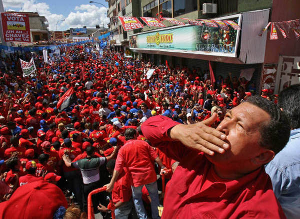 This file picture shows Venezuelan President Hugo Chavez greeting supporters during a political gathering in the town of Guarico, some 100 km southwest of Caracas, 24 November 2006. Venezuelan President Hugo Chavez passed away on March 5, 2013 in Caracas after a long fight with cancer, Venezuelan Vice President Nicolas Maduro